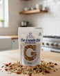 Bag of 'The Granola Kid' cran-cinni bliss granola on a kitchen counter.